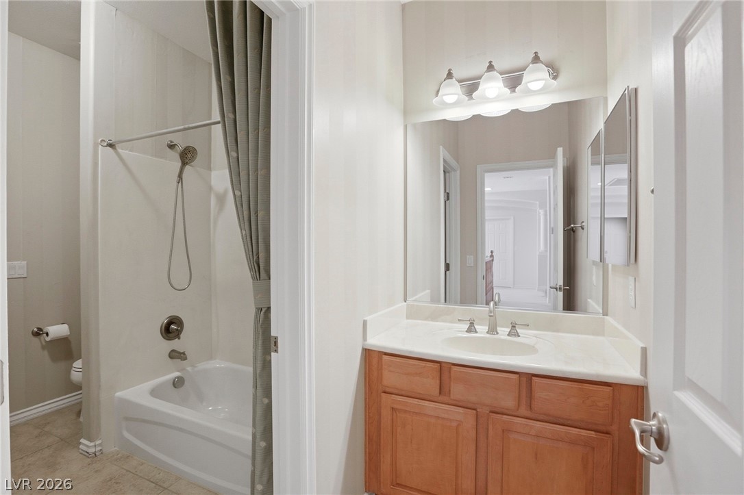 Single vanity, shower, and toilet in the Jack-and-Jill bathroom